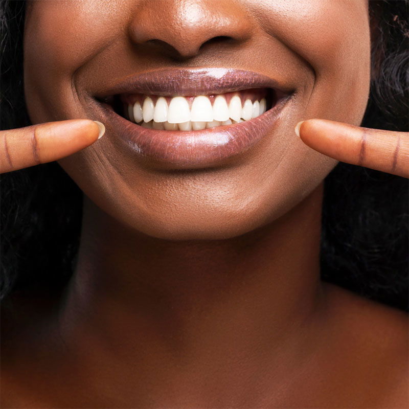 Woman Showing off flossed Teeth