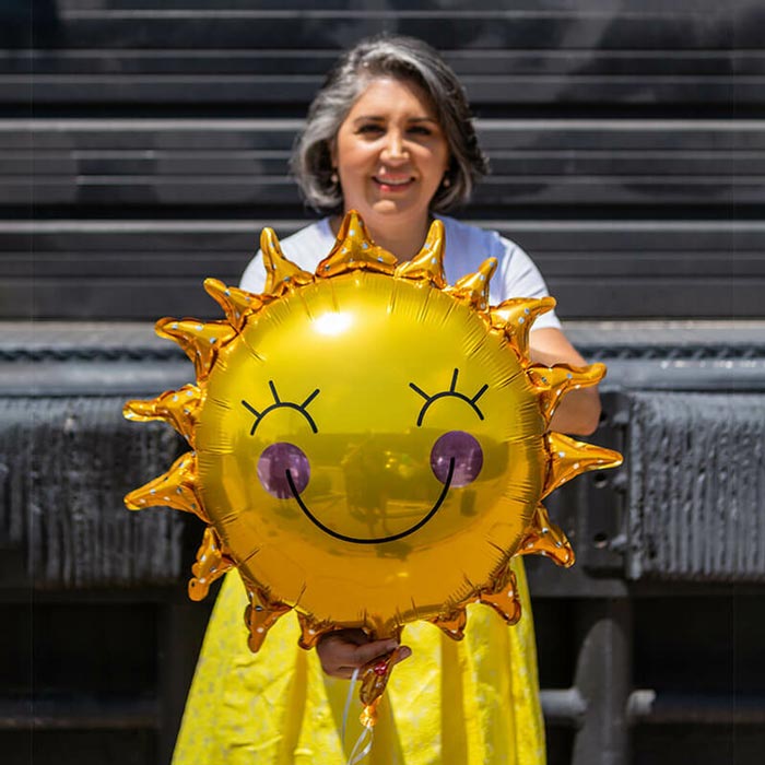 Dr. Safavi Holding a Sun Balloon